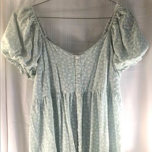 Knee length light green dress with white flowers